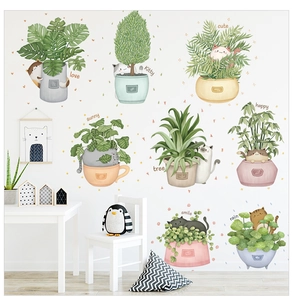 Detailed view of cute cat and potted plant wall stickers in soft pastel colors for home decor