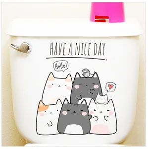 Waterproof cartoon cat toilet decals with Have a Nice Day text on white ceramic surface