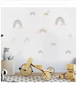Detailed view of Morandi rainbow and raindrop wall stickers in a cozy nursery setting