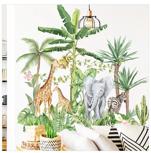 Detail of tropical rainforest wall stickers with giraffe and elephant in a modern living room