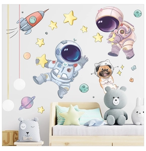 Detail of space stickers showing astronauts, rockets, and stars in a cozy child room