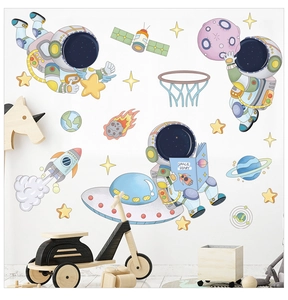 Detailed view of astronaut and rocket wall decals in a modern nursery setting