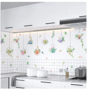 Close-up of hanging succulent plant wall stickers with geometric frames for kitchen decor