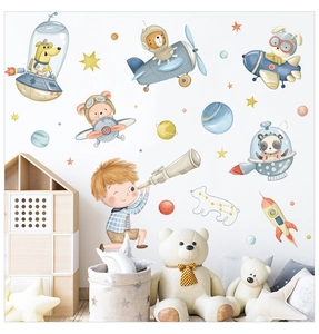 Detail of animal astronauts and stars wall stickers in a cozy nursery room setting