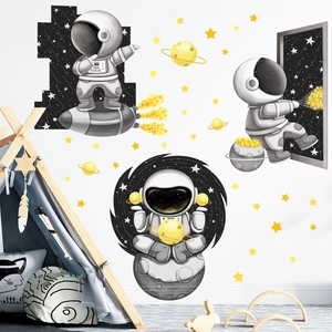Cartoon astronaut and spaceship wall decals for space themed nursery room decoration