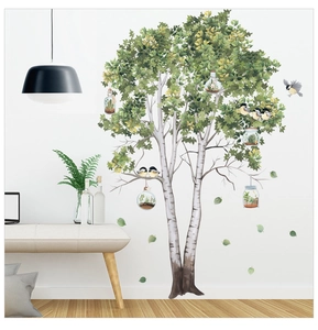 Macro detail of birch tree wall decal with leaves, birds and small glass terrariums