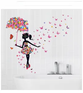 Detail of floral umbrella and butterfly girl wall stickers on bathroom tile wall