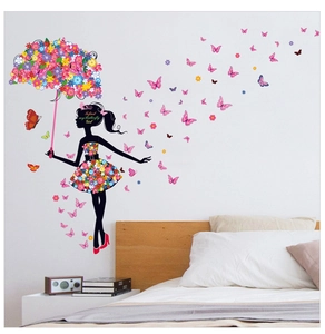 Detail of dancing fairy wall sticker with colorful floral umbrella and butterfly decals