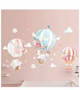Nursery wall decals featuring cartoon elephant, giraffe, and zebra in hot air balloons