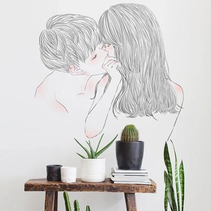Minimalist black and white wall sticker showing a romantic couple kissing illustration