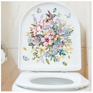 Floral toilet lid sticker featuring lilies, green leaves, hummingbirds and blue butterflies
