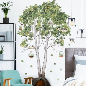 Birch tree wall decals with green leaves and birds for a natural bedroom wall decor