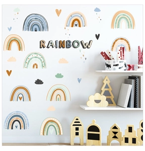 Detail of Nordic boho rainbow wall decals with clouds and hearts for nursery room decor