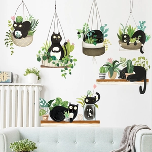 Creative wall decals featuring black cats and green hanging plants for home decoration