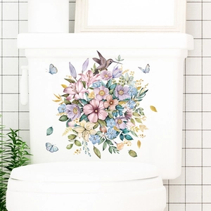 Watercolor flower wall sticker with pink lilies and hummingbird on a white toilet tank