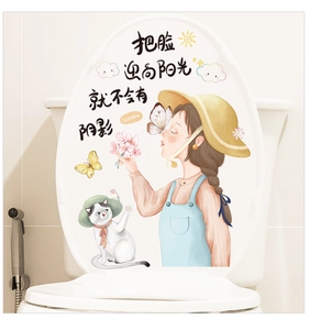 Detail view of cartoon girl and cat decorative sticker on a white bathroom toilet lid