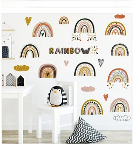 Close-up of Bohemian rainbow wall decals with heart and cloud motifs in a nursery setting
