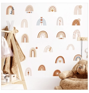 Detail of bohemian rainbow wall stickers with sun and moon motifs in earthy tones