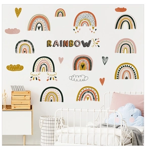Detail view of boho rainbow wall stickers in a cozy nursery room setting with soft colors