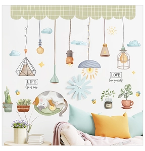 Detail of cartoon sleeping cat and potted plant wall stickers in a cozy nursery room