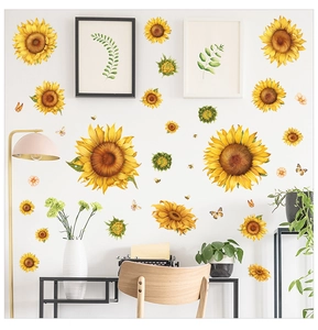 Detail of vibrant sunflower wall decals with butterflies on a clean white interior wall