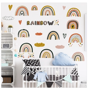 Boho style rainbow and cloud wall stickers set for nursery room decor with warm earth tones