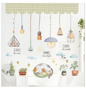 Detail of hand-drawn cartoon cat wall stickers with hanging lamps and succulents