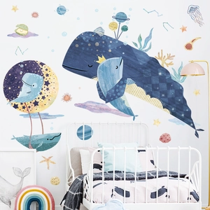 Kids whale and starry sky wall stickers in blue tones on white bedroom wall