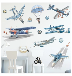 Détail de stickers muraux sur l'aviation avec des avions à hélice bleus et des parachutes