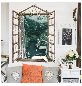 Detail of a 3D window wall sticker featuring a cat and lush green garden view