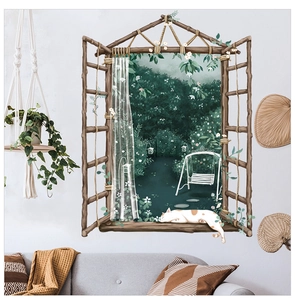 Detail of 3D window wall sticker with cat and forest view on light blue wall