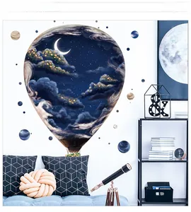 Macro detail of hot air balloon wall sticker showing starry night and moon on a white wall