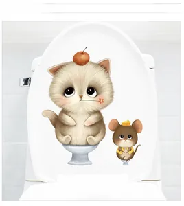 Detail of cute hand-drawn cat and mouse stickers applied on a white toilet seat cover