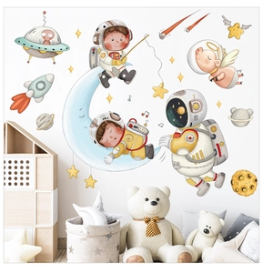 Space themed wall decals with cute astronaut, moon and star elements for kids room decor