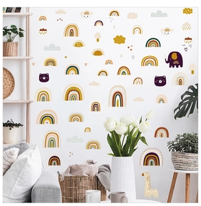 Detail of boho nursery wall stickers with rainbow, elephant and giraffe in warm earthy tones