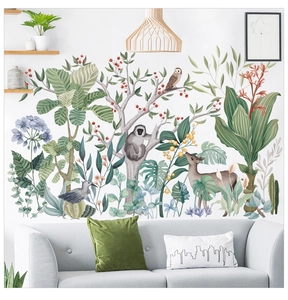 Detail of tropical rainforest wall decals with monkeys and deer in a cozy living room