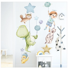 Detail of cartoon dinosaur and space themed wall stickers in a modern nursery room