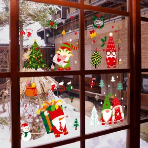 Christmas window clings set featuring festive gnomes and snowflakes on glass window