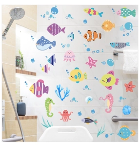 Colorful sea fish wall decals set on white bathroom tiles with ocean bubbles