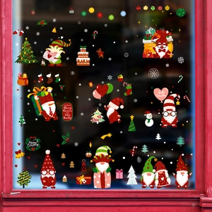 Christmas window clings set featuring gnomes, snowflakes and festive trees for glass