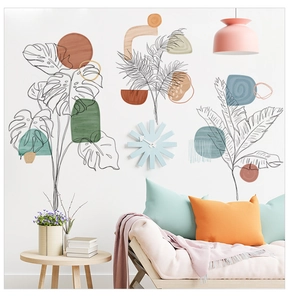 Detail of tropical leaf line art stickers with Morandi geometric shapes on a white wall