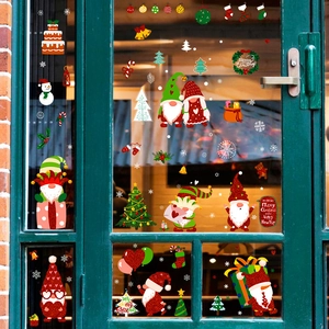 Christmas gnomes and Santa Claus static window decals with festive glitter on glass door