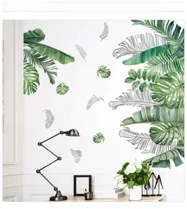 Stickers muraux tropicaux Monstera au-dessus d'un bureau dans une chambre