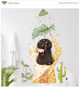 Detail effect display of decorative wall stickers featuring a girl and green leaves