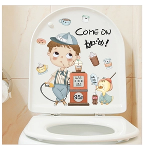 Close-up of cute cartoon boy and yellow duck stickers on a white toilet lid