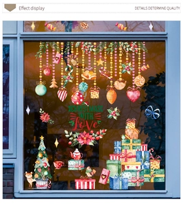 Detailed view of watercolor Christmas tree window stickers with gift boxes and ornaments