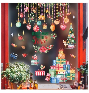 Detail showing festive Christmas window stickers with hand-drawn trees and ornaments