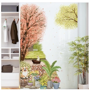 Detail of cherry blossom and cartoon dog wall decals applied on a white sliding wardrobe