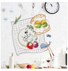 Detailed scene of cartoon food stickers and Life Is Lovely quote on white brick kitchen wall