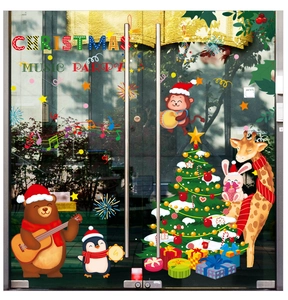 Detail of Christmas window stickers featuring cartoon animals and festive music party theme